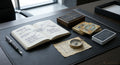 Book with 3 decks of tarot cards to its side on top of an office desk. 